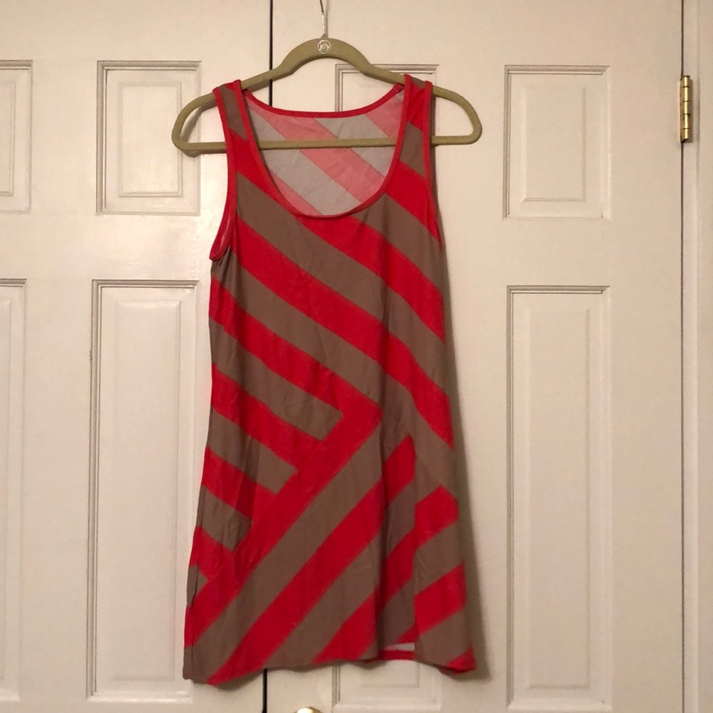 Nylon/Spandex combo asymmetric design sun dress.